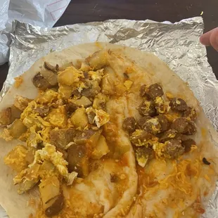 Sausage, Egg, and Potato burrito....  More like potato burrito with a sprinkle of everything else.