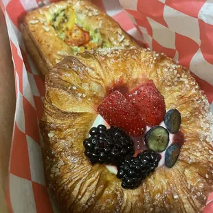 a croissant pastry with fruit on top