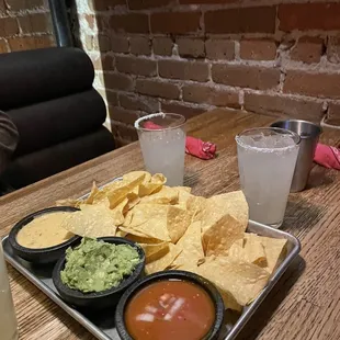 Chips, Salsa, queso and guacamole.