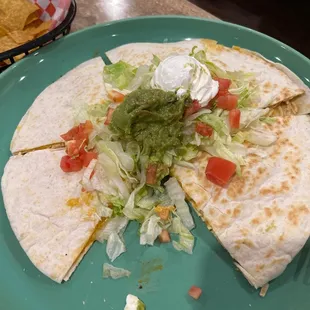 a tortilla on a green plate