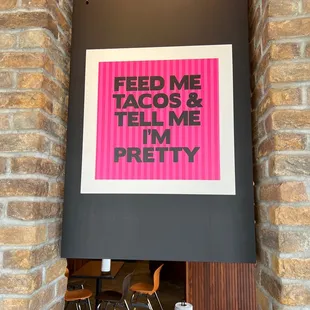 a sign that reads feed me tacos and tell me i'm pretty