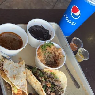 wet taco fried and crispy it's the one half gone!  Al pastor with green sauce, steak at the top with the dipping juice for wet taco yummy