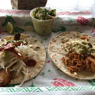 Chicken Tinga taco and the blackened fish taco with guacamole'.