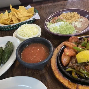 Steak fajitas, chips and salsa, and grilled jalapeños!