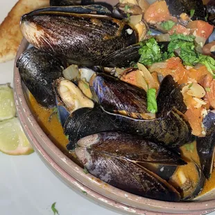 a bowl of mussels and clams