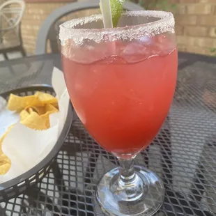 Raspberry margarita on the rocks with sugar.