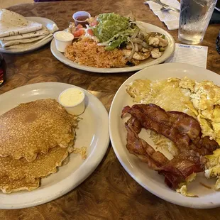 Pancakes, eggs and bacon plate. Chicken fajita plate.