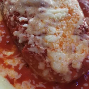 a plate of food with sauce and cheese
