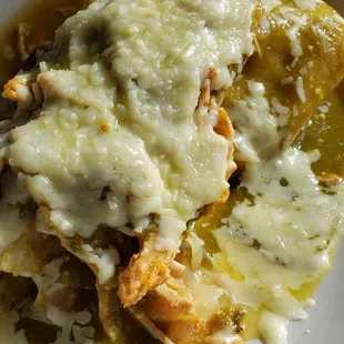 Tamale with verde sauce.