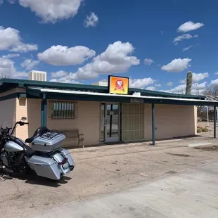 a motorcycle parked in front of a building