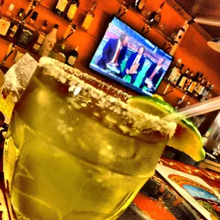 a margarita with a lime garnish