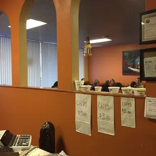 a man sitting at a desk with a calculator in front of him