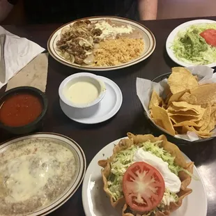Chile relleno, salsa, queso, pork carnitas dinner (comes with the plate of veggies and guac), chips, taco salad w/ ground beef + no guac