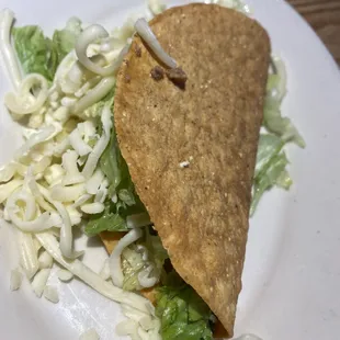 Ground beef taco part of Speedy Gonzales lunch