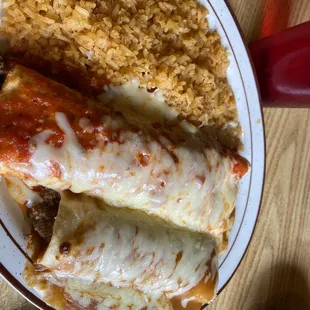 a plate of enchiladas and rice