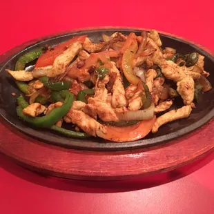 chicken and peppers in a skillet