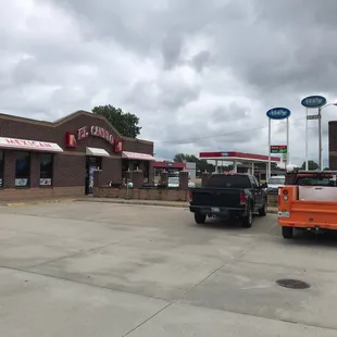 two trucks parked in front of a restaurant
