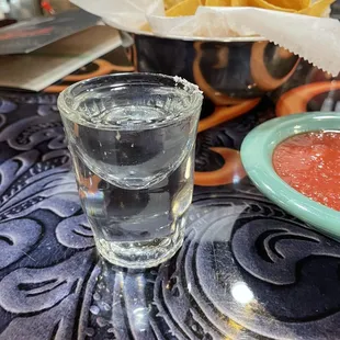 a glass of water and tortilla