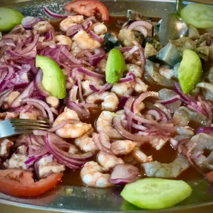 a plate of seafood and vegetables