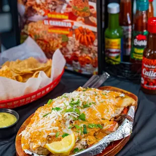 One of our best sellers, Filete Relleno! Stuffed fish filet served with rice, beans, salad and tortillas