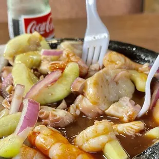 A master piece of ice cold seafood Shrimp, Pulpo, Callo de acha on a chilled molcajete what a great touch to keep you seafood ice cold!!