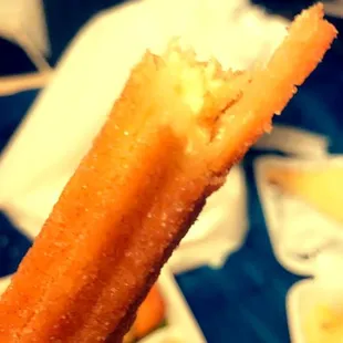 MY FAVORITE THING EVER IS A CHURRO. THESE ONES ARE AMAZING!. (cinnamon sugar perectly crunchy then biting into a creamy goodness in middle)
