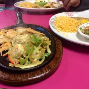 Sizzling chicken and shrimp fajitas!
