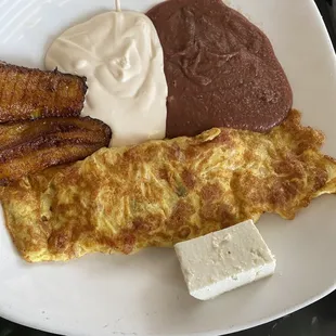 Omelette, crème, beans and plantains.