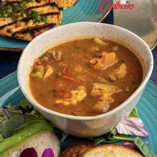 a bowl of soup and bread