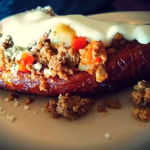 Plantain Stuffed with Ground Beef n Veggies topped with Salvadorian Creama so unique n addictive you must try.
