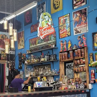 Service bar, the place is littered with posters for wrestling, movies, and more. Such a vibrant atmosphere with great music.