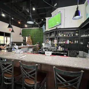 a bar with chairs