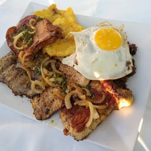 Completa cubana: chicken, pork, steak, smoke pork chop, tostones, egg, rice