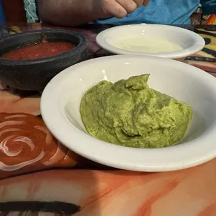 Salsa, guacamole and white queso. Chips not pictured