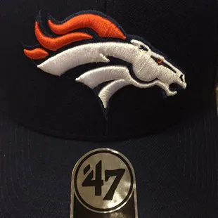 a close up of a denver broncos hat