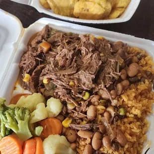Ropa vieja lunch special with a side of freshly made tostones