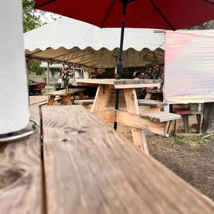 a picnic table with an umbrella