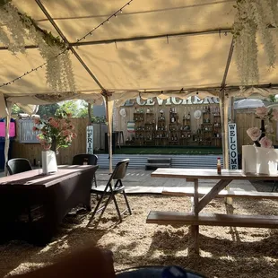 tables and chairs under a canopy