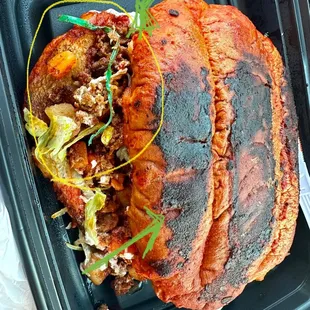 A wire from the package of tortillas!! The bread was burnt.