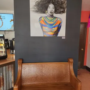 Artwork display and a place to take a seat when the line is long.. Or simply to enjoy a coffee.