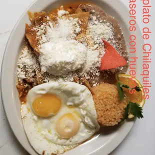 Breakfast chilaquiles plate with queso cotija. Along with 2 eggs