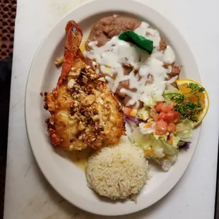 Lobster tail with garlic, along with rice and beans