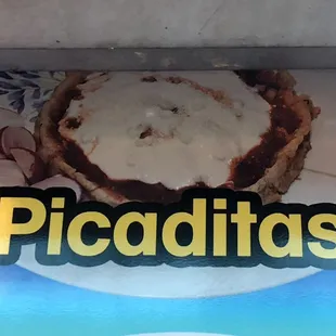 Picaditas Like sopes but with cheese, cream, salsa(red or green) and chopped onions