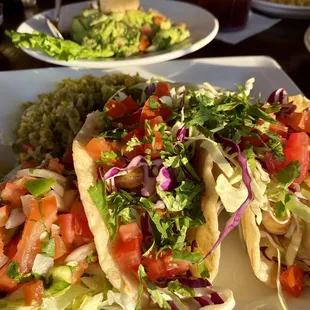 Shrimp tacos and the freshest chunky guacamole in the background - highly recommend!