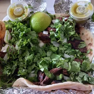 Carne tacos. I asked for extra green sauce.