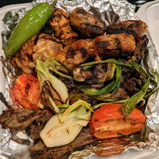 La Parrillada para Dos. Churrasquito, carne adobada, pollo asado, grilled tomato &amp; jalapeno, salad, rice, beans. +Chorizo, longaniza. $29.99