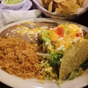 Taco and two flautas, rice and beans. All beef. All good, I love how they don&apos;t skimp on the cheese.. ever.