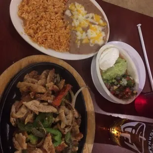 Chicken fajitas. The rice and beans were so yummy definitely a plus to have more.