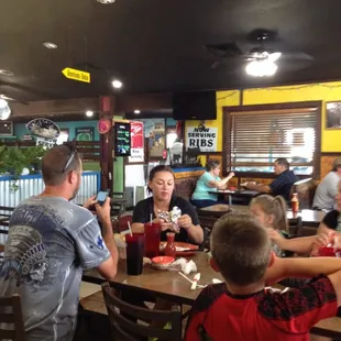 a group of people eating at a restaurant
