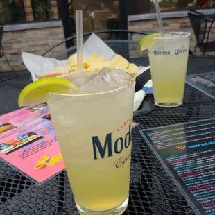 two drinks on a table outside